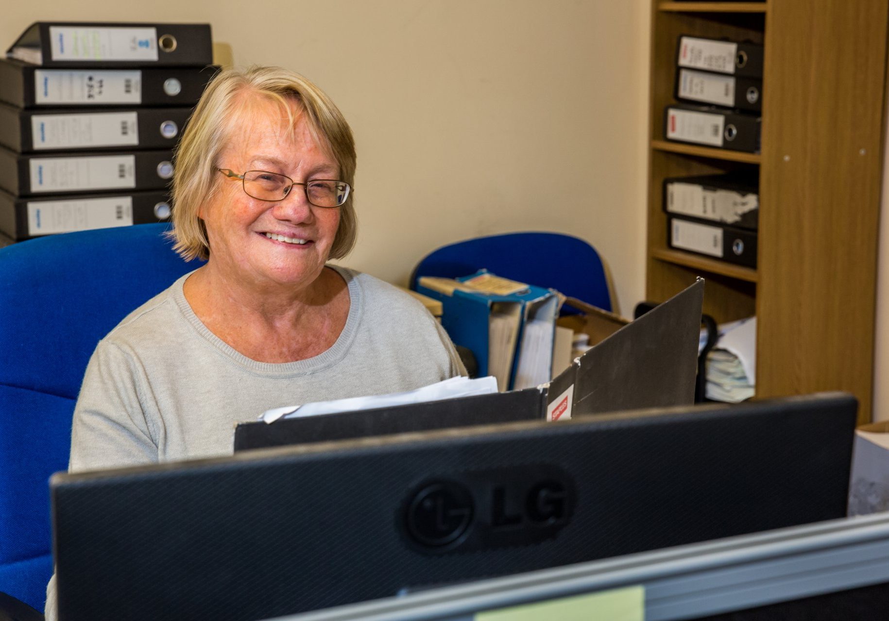 woman working behind computer